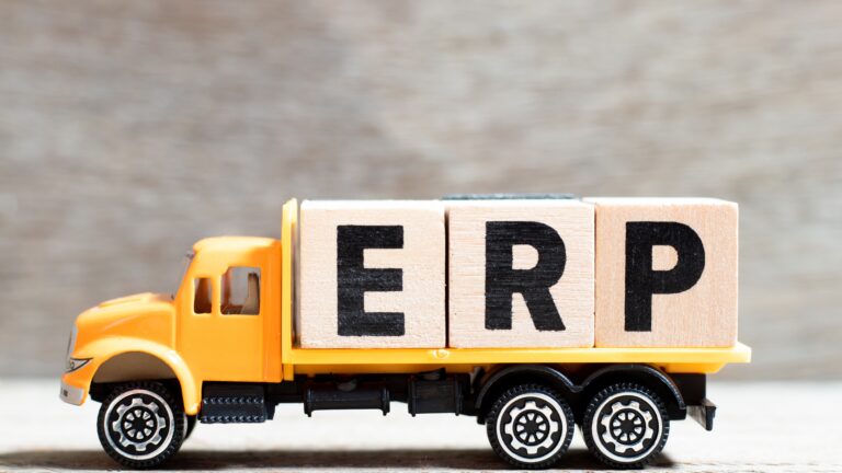 Truck carrying ERP blocks highlighting fuel tax reporting issues during system changes.